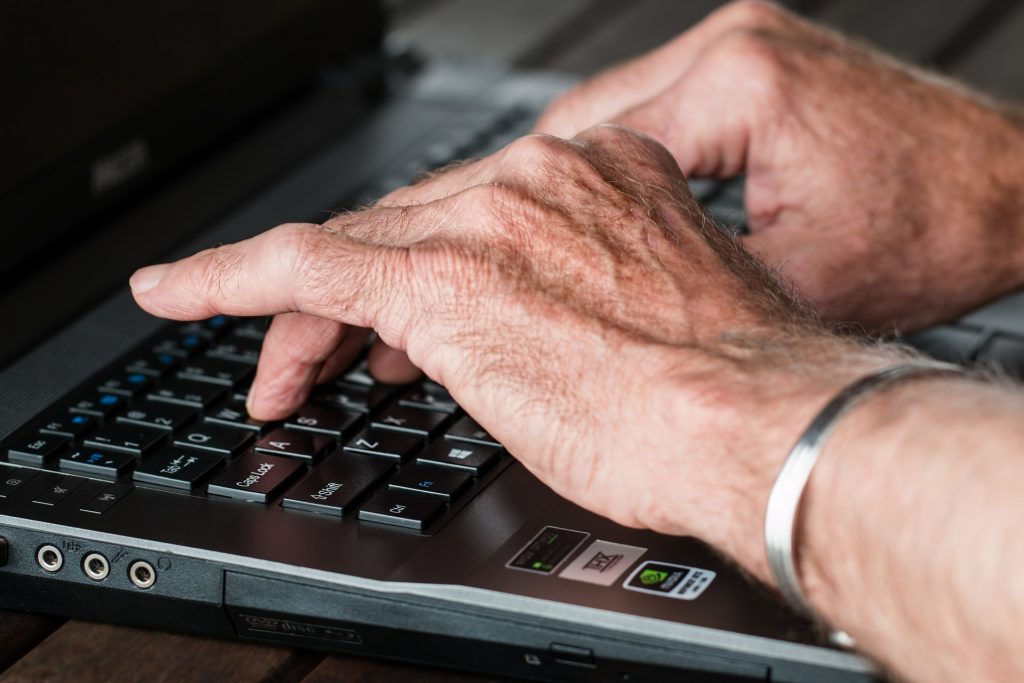 hands typing computer