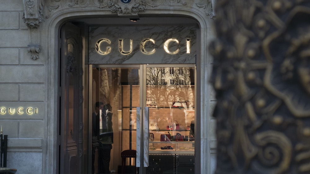 who owns gucci